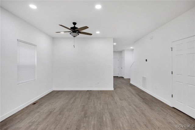 unfurnished room featuring hardwood / wood-style flooring and ceiling fan