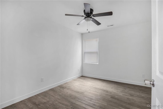 unfurnished room with ceiling fan and dark hardwood / wood-style floors