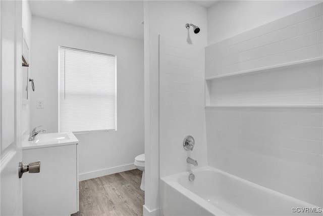 full bathroom with hardwood / wood-style floors, shower / bath combination, toilet, and vanity