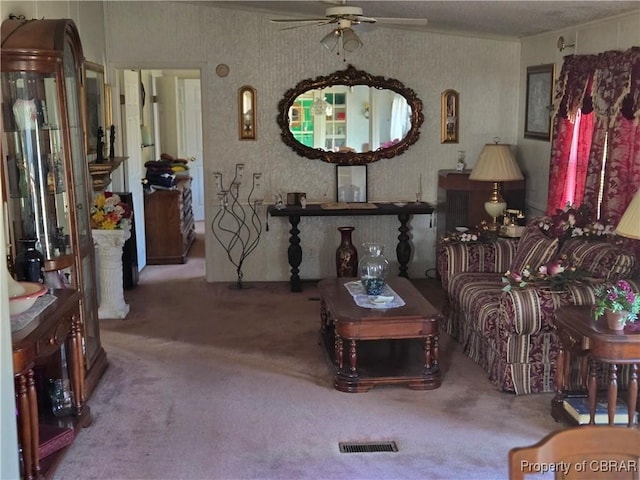 carpeted living room featuring ceiling fan