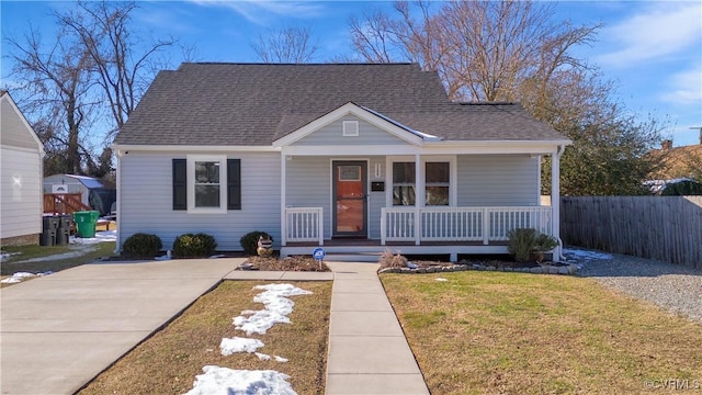 bungalow-style house featuring a porch and a front yard