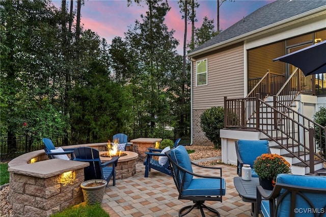 patio terrace at dusk with an outdoor fire pit