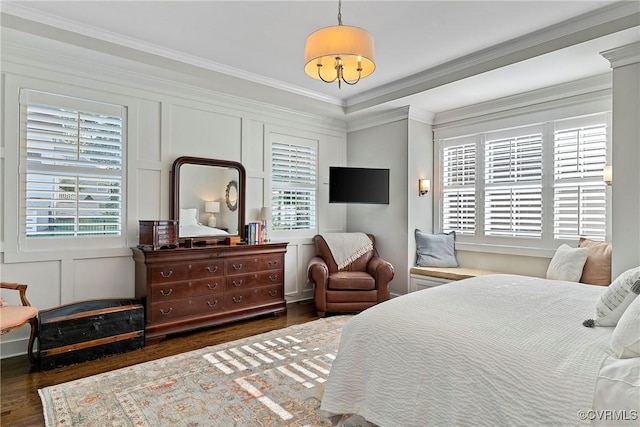 bedroom featuring crown molding and dark hardwood / wood-style floors