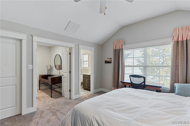 bedroom with multiple windows, vaulted ceiling, light colored carpet, and ceiling fan