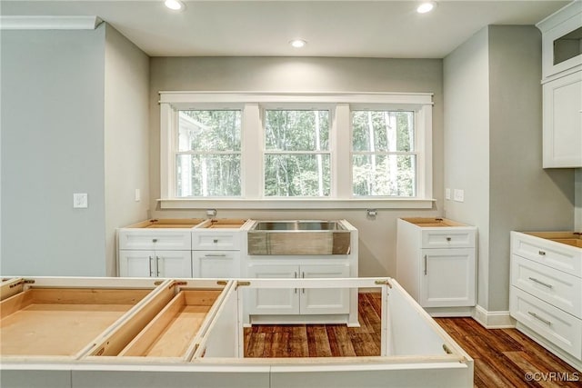 kitchen featuring a kitchen island, white cabinets, and dark hardwood / wood-style flooring