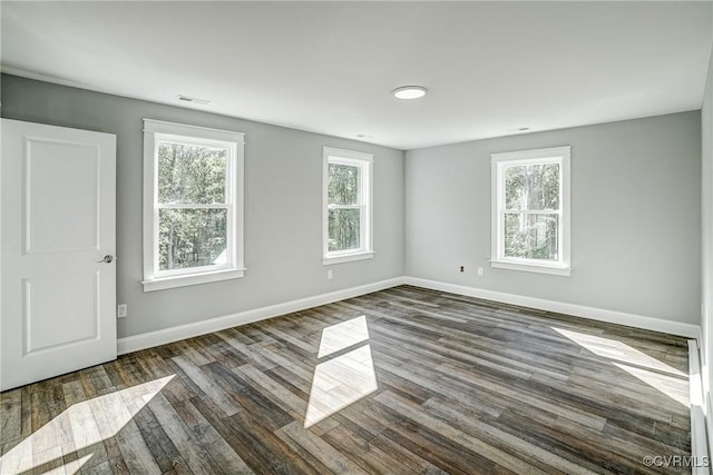 spare room with dark wood-type flooring