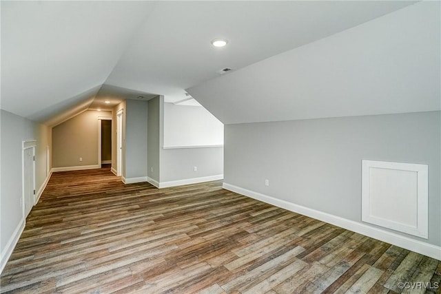 bonus room featuring lofted ceiling and wood-type flooring