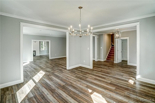 unfurnished dining area featuring ornamental molding and dark hardwood / wood-style floors