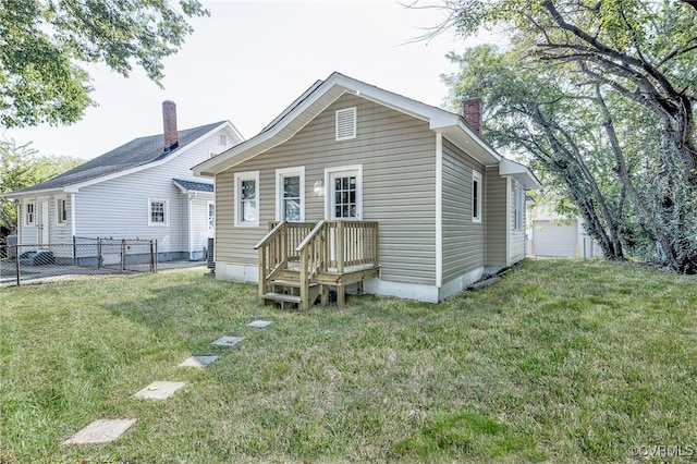 back of house with a yard