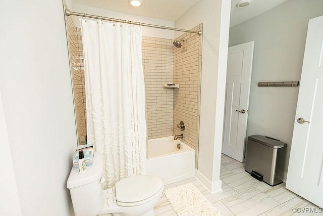 bathroom with toilet and shower / bathtub combination with curtain