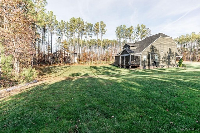 view of yard with a sunroom