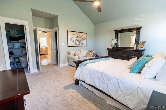 bedroom featuring light carpet, lofted ceiling, and ceiling fan