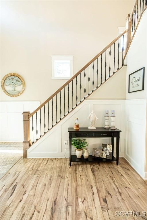 stairs featuring hardwood / wood-style flooring