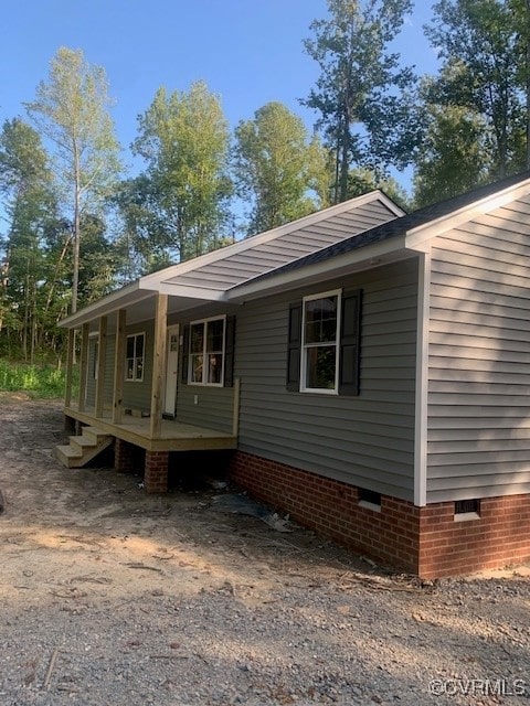 view of property exterior with a porch