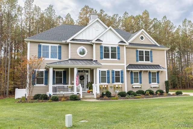 view of front of home featuring a front yard and a porch