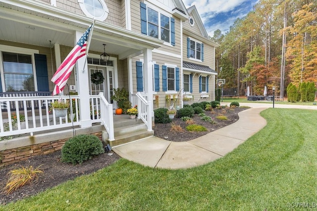 entrance to property with a yard