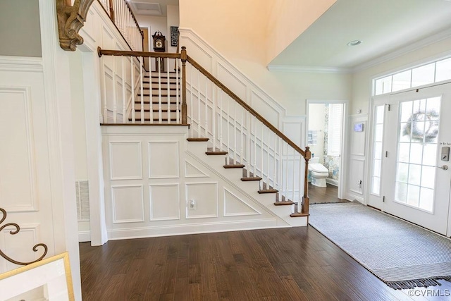 entryway featuring dark hardwood / wood-style floors and ornamental molding