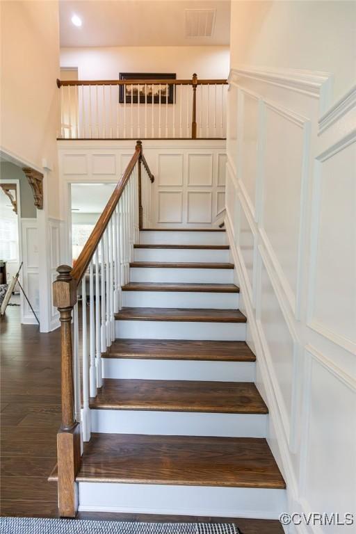 staircase featuring hardwood / wood-style flooring