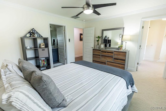 carpeted bedroom with ceiling fan, connected bathroom, and ornamental molding