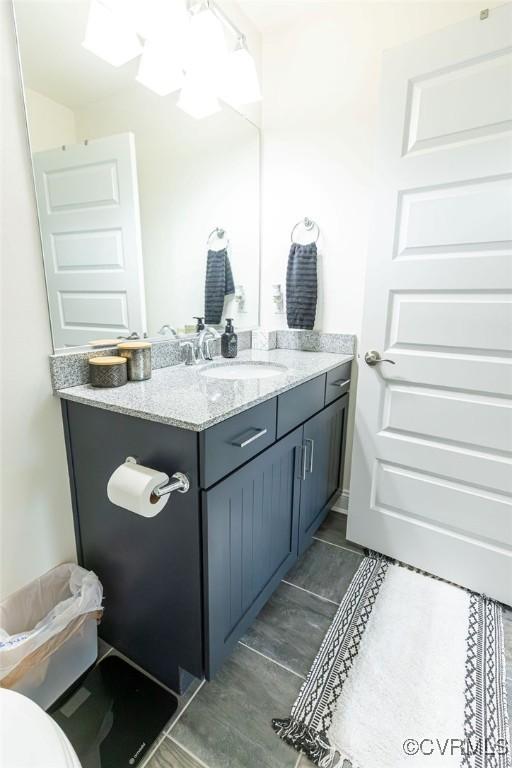 bathroom with tile patterned floors and vanity