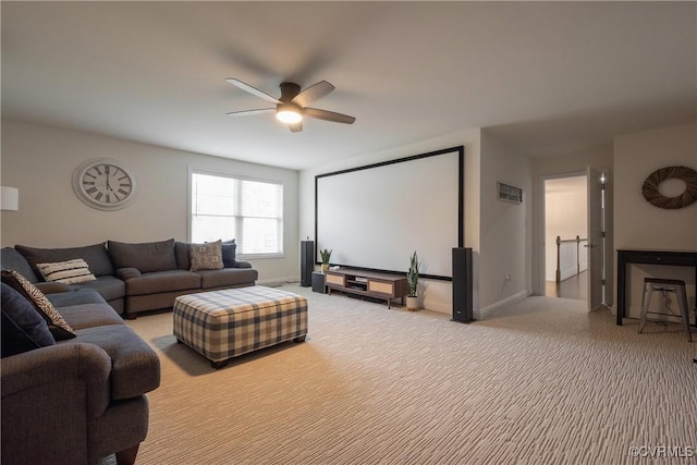 carpeted living room with ceiling fan