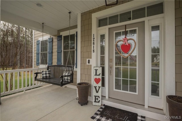 entrance to property featuring a porch