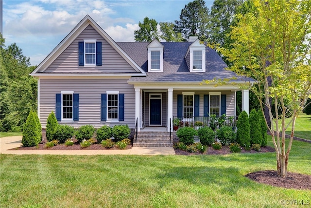 cape cod house featuring a front yard and covered porch