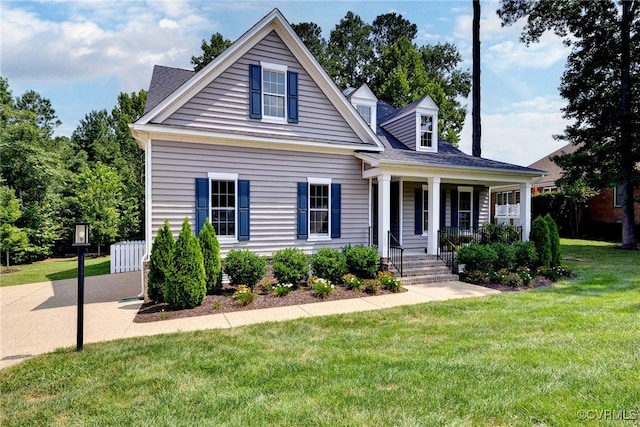 view of front of home with a front yard and covered porch