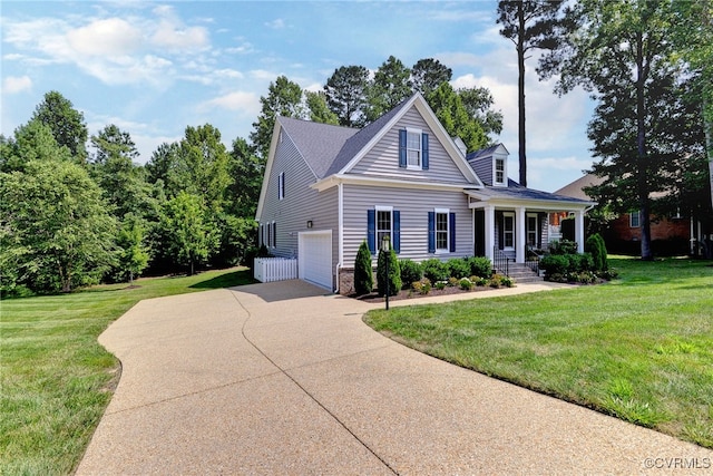 view of front facade with a front yard, a garage, and a porch