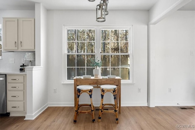 dining room with light wood-type flooring