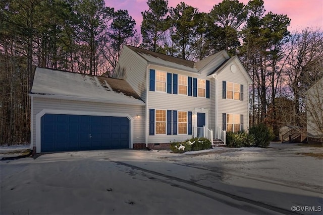 colonial house featuring a garage