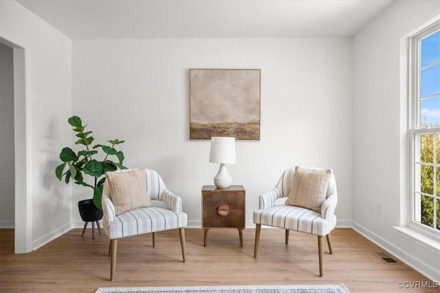 sitting room with light hardwood / wood-style flooring