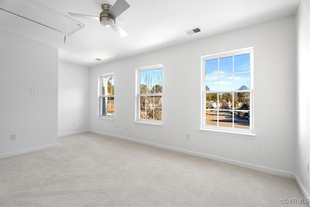 carpeted empty room with ceiling fan