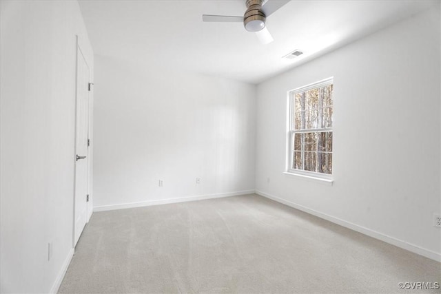 empty room with light carpet and ceiling fan