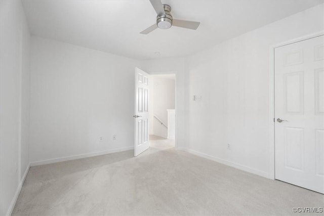 unfurnished room with light carpet and ceiling fan