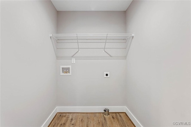 laundry area with hookup for a washing machine, hookup for an electric dryer, and hardwood / wood-style floors