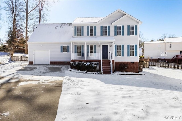 view of front of home featuring a garage and a porch