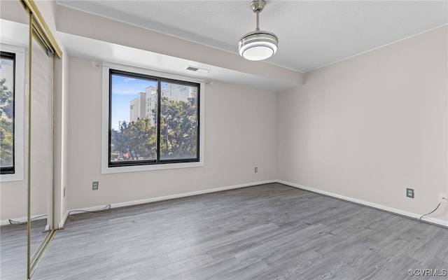 spare room featuring light hardwood / wood-style flooring