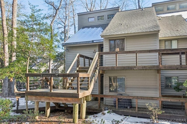 rear view of property with a wooden deck