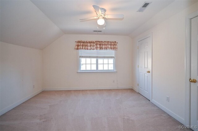 bonus room with ceiling fan, vaulted ceiling, and light carpet