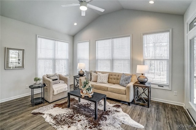 living room featuring hardwood / wood-style floors, ceiling fan, and vaulted ceiling