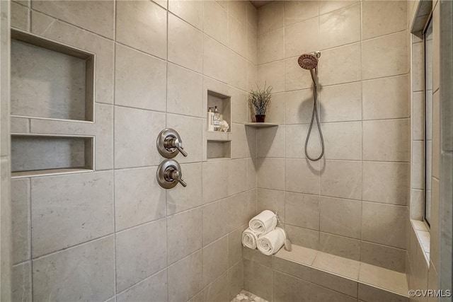 bathroom featuring a tile shower