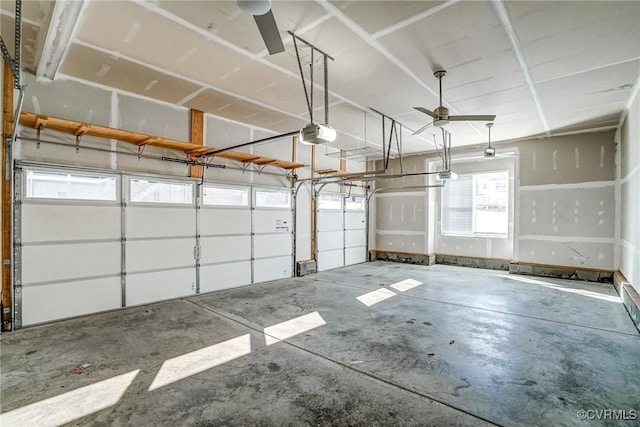 garage featuring a garage door opener and ceiling fan