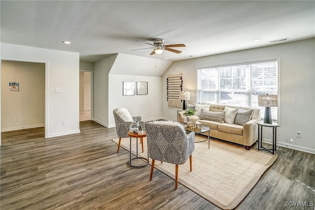 living room with ceiling fan, lofted ceiling, and dark hardwood / wood-style floors