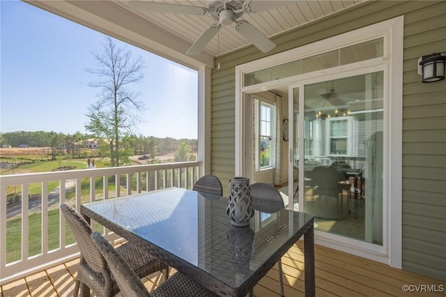 wooden deck featuring ceiling fan