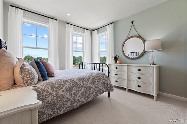 bedroom featuring light colored carpet