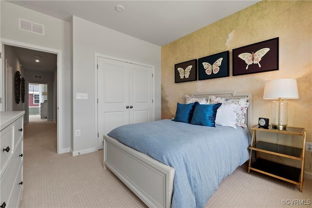 carpeted bedroom featuring a closet