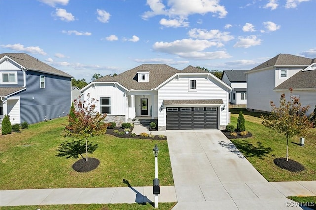 view of front of house featuring a front lawn and a garage