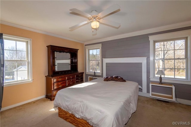 bedroom with ceiling fan, light colored carpet, and multiple windows