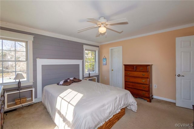 carpeted bedroom featuring multiple windows, ceiling fan, and ornamental molding